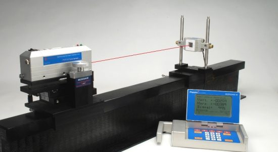 Laser alignment transmitter and receiver setup for tracking straightness and rail alignment.