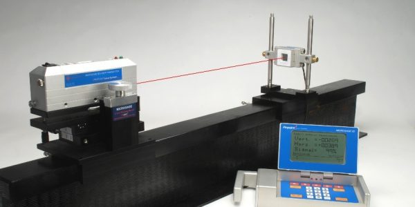 Laser alignment transmitter and receiver setup for tracking straightness and rail alignment.