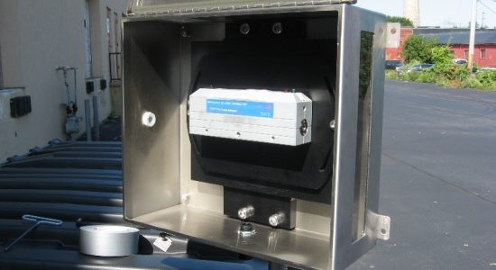 Custom laser transmitter in weatherproof and vandal proof enclosure for hydro dam monitoring.